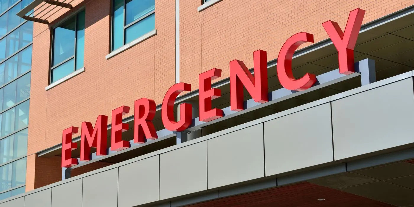 An emergency department sign on a hospital building