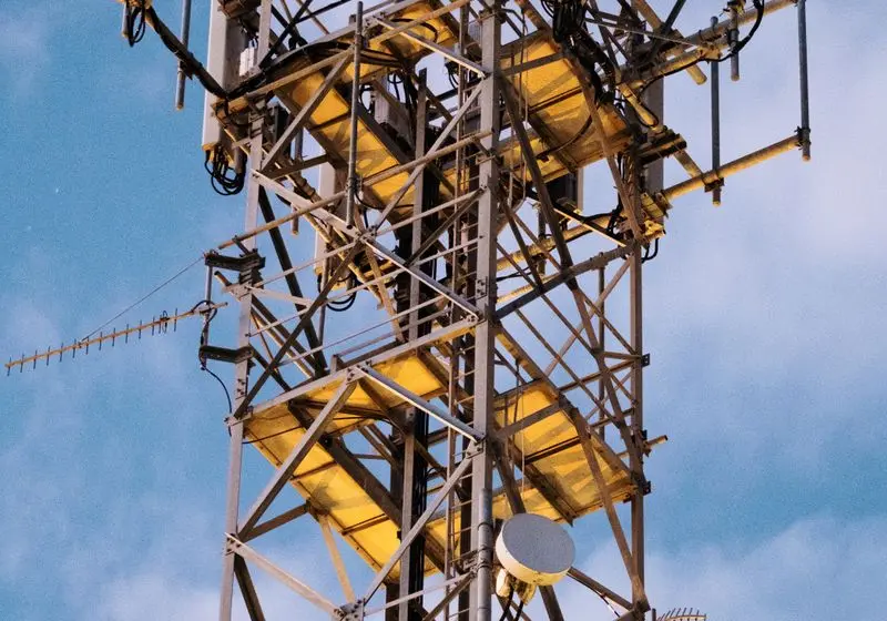 Telecommunications mast against a clear sky